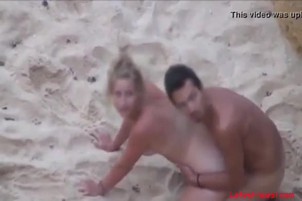 Caught woman masturbatie on beach